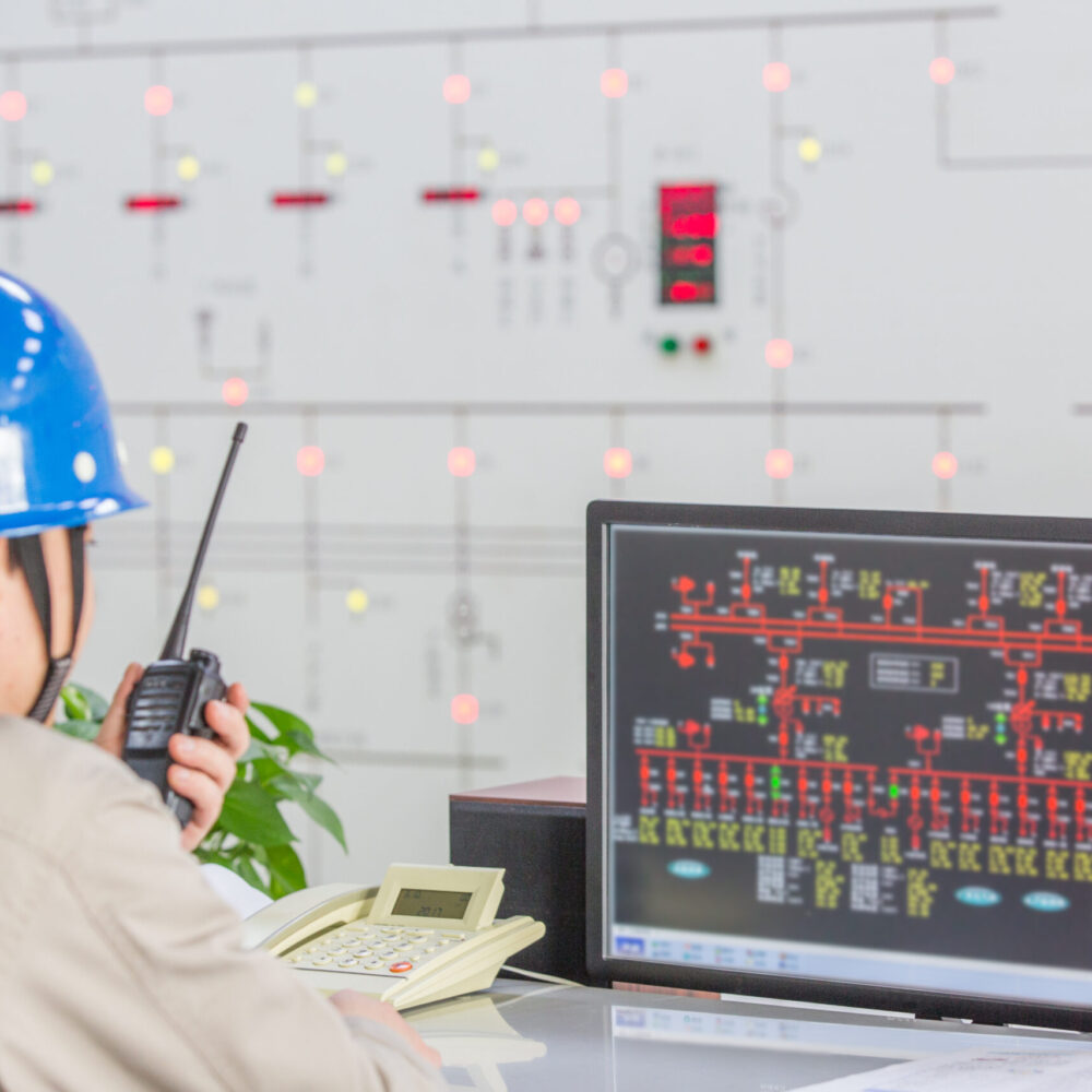 workers in control room of a factory.